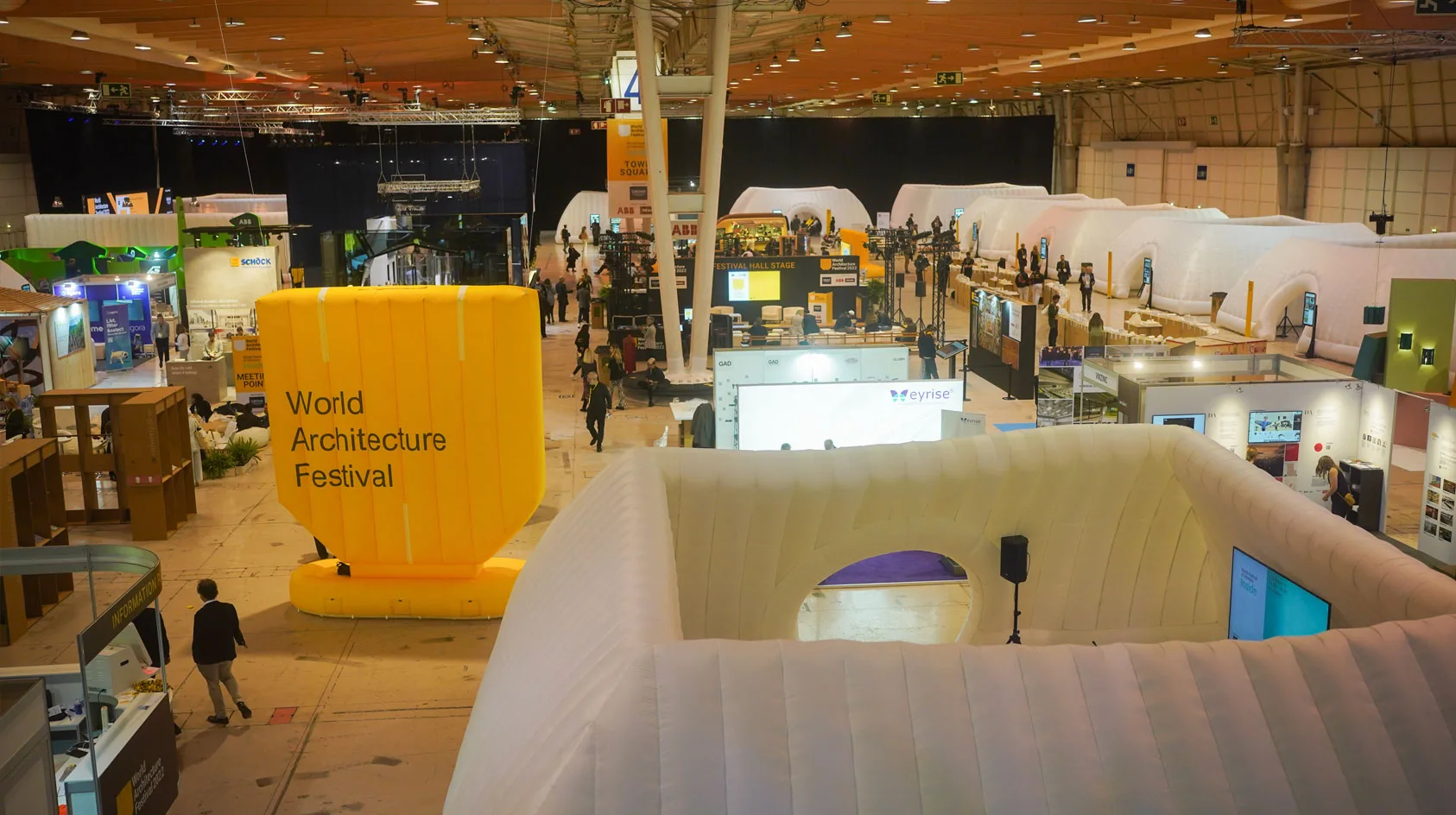 Pic showing several Created By Air inflatable event structures and inflatable type at a recent indoor architecture event