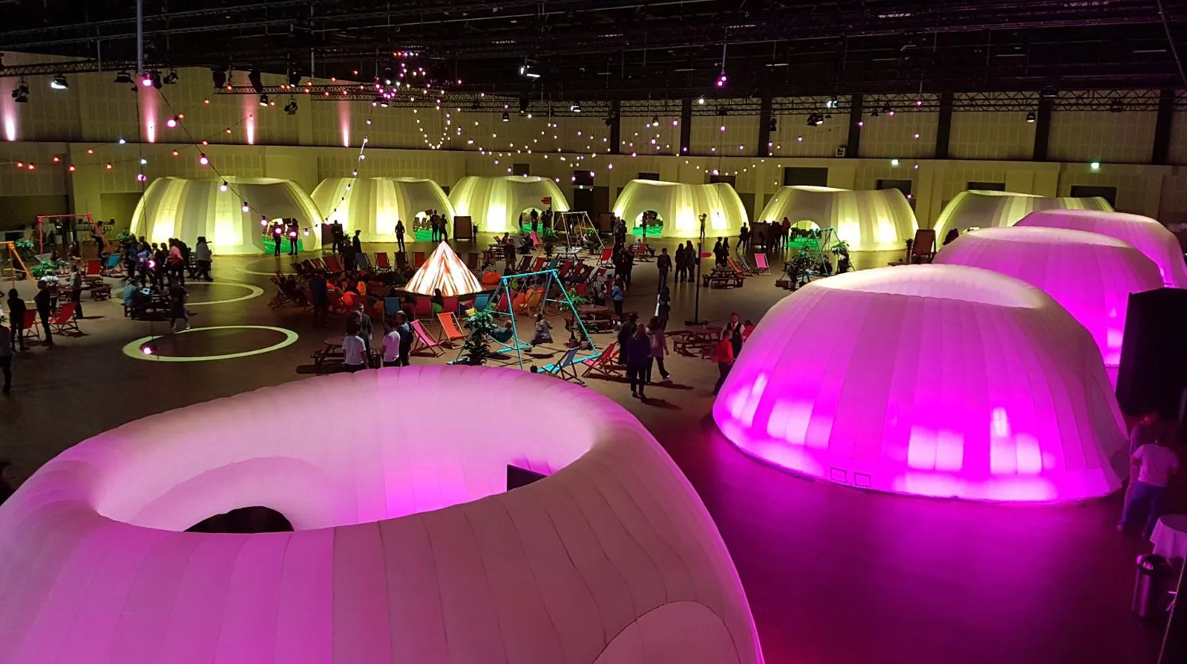 Pic showing the Created By Air Panoramic inflatable structures lit using both yellow and pink LED lighting