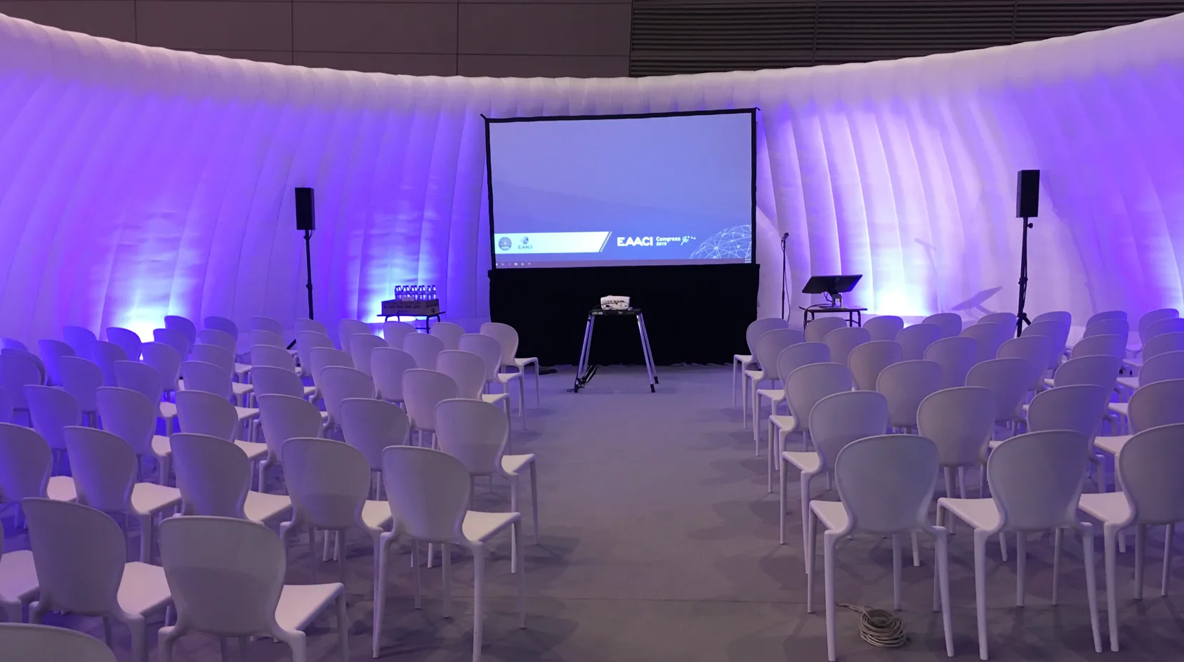 Pic showing the inside of a Created By Air Panoramic event structure set up with seminar style seating